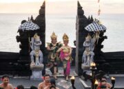 Balinese dancers perform at the iconic Uluwatu Temple during sunset, showcasing vibrant traditional attire.