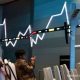 Grafik pergerakan harga saham PT Singaraja Putra Tbk (SINI) di layar monitor bursa efek