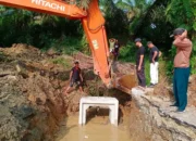 pulihkan-akses-warga,-pemkab-dharmasraya-perbaiki-gorong-gorong-jalan-nagari-simalidu