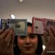 Grafik pergerakan nilai tukar mata uang Rupiah terhadap Dolar AS di layar monitor perdagangan pasar spot