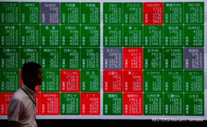 Tampilan layar grafik pergerakan harga saham di bursa efek Asia yang menunjukkan tren kenaikan