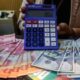 Grafik pergerakan nilai tukar mata uang Rupiah terhadap Dolar Amerika Serikat di layar monitor