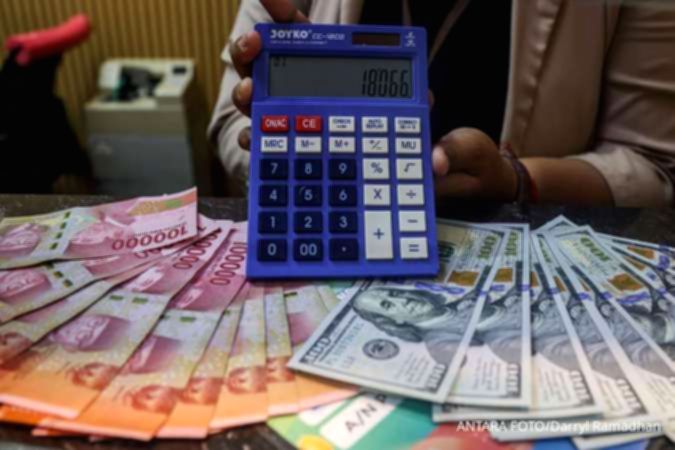 Grafik pergerakan nilai tukar mata uang Rupiah terhadap Dolar Amerika Serikat di layar monitor